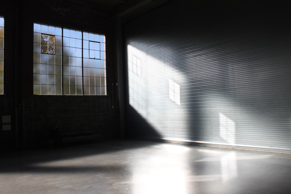 A residential garage with lots of natural light