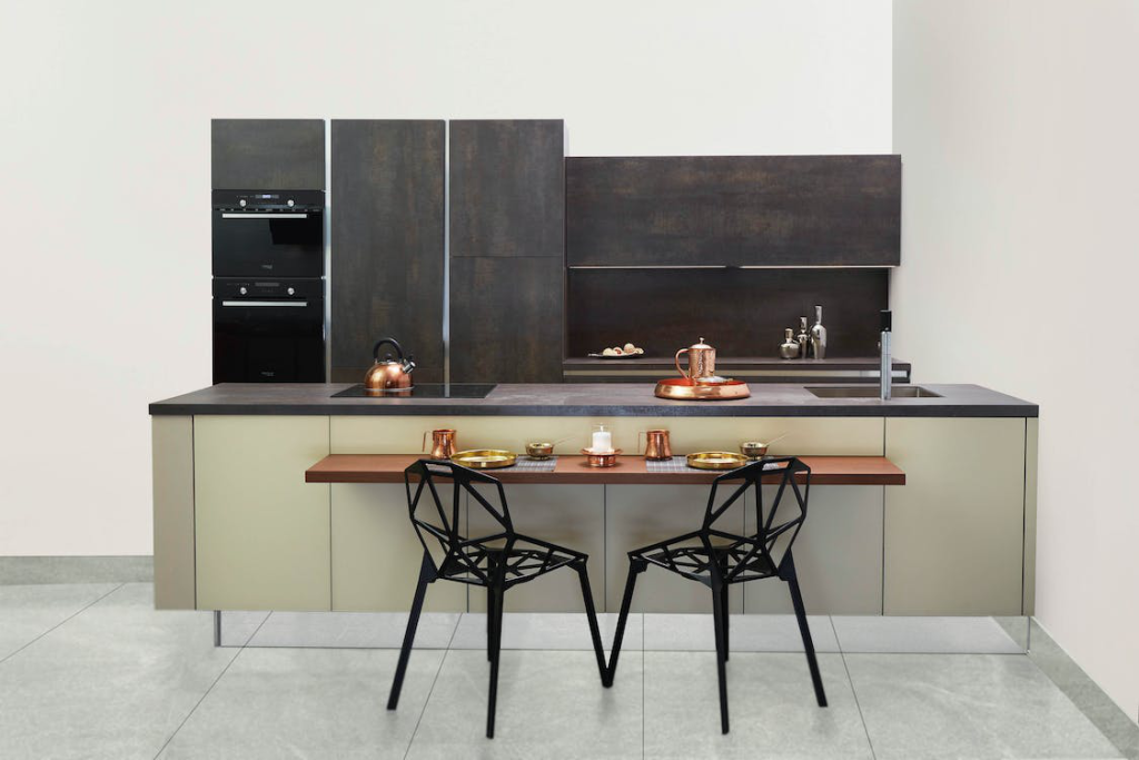 A small kitchen space in dark tones