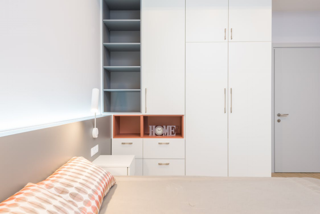 A small bedroom with spacious storage compartments