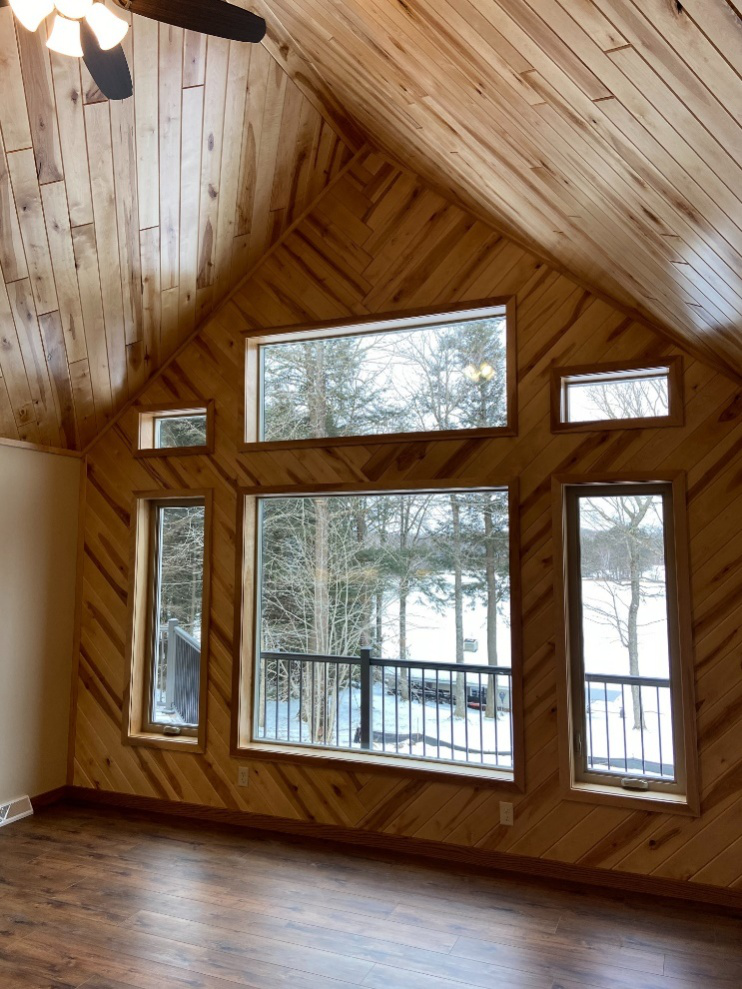 A room with huge windows on a wall for better natural sunlight