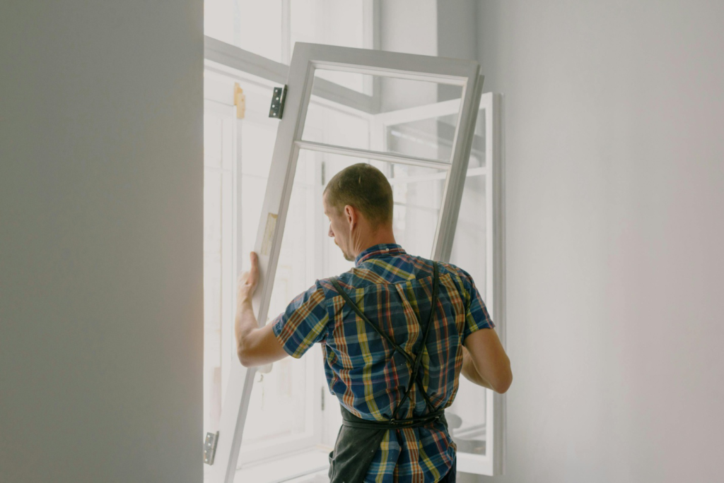 A man changing a window