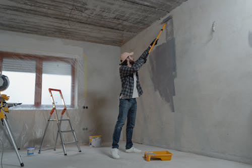 A man painting the inside of the walls