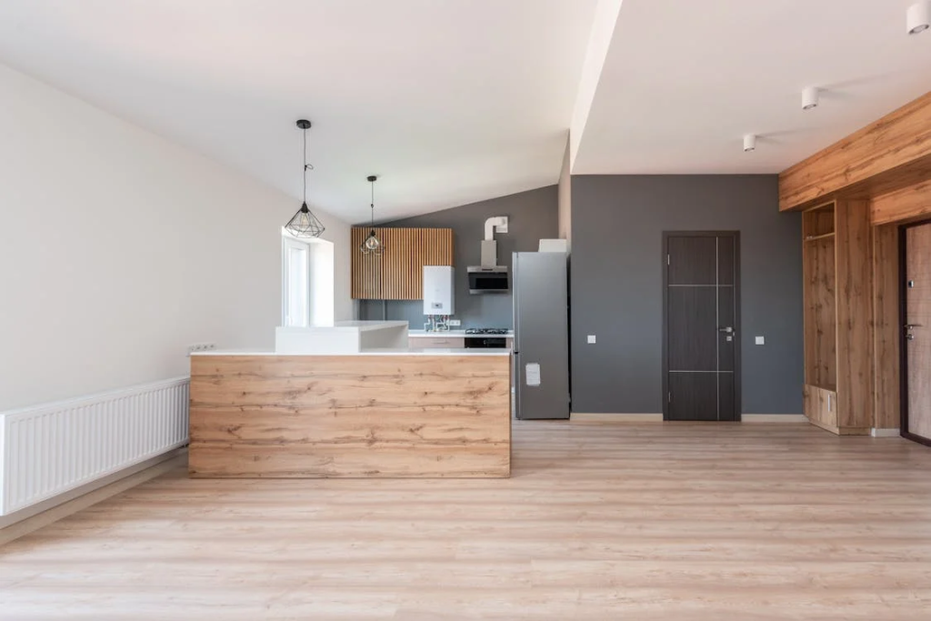 A modern kitchen with an open layout featuring smart appliances and a sleek, minimalist design.