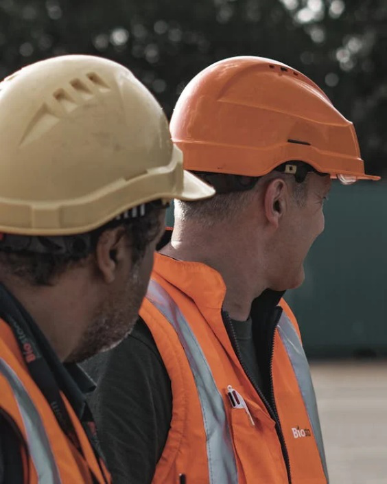 An image of men wearing safety helmets  